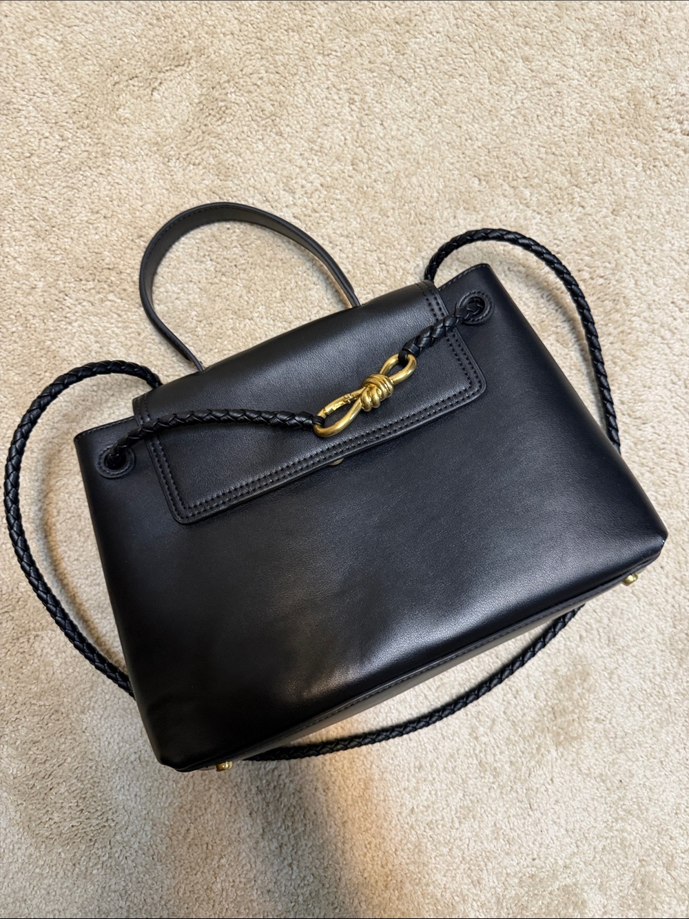 Classic Black Leather Shoulder Bag with Braided Strap and Gold Accent